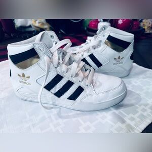 Adidas Hard Court High in a white, black, and gold
